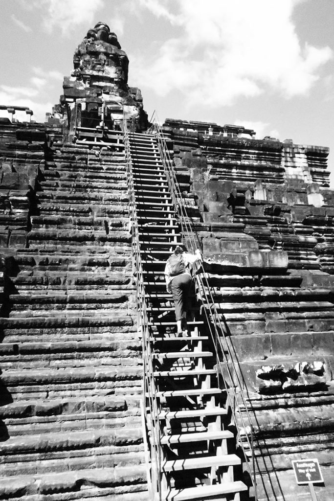 Carol climbing Baphuon